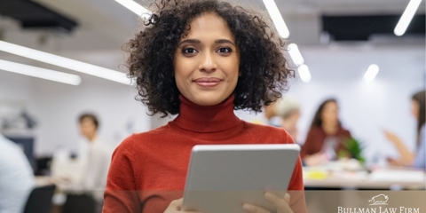 African American female worker holding a tablet